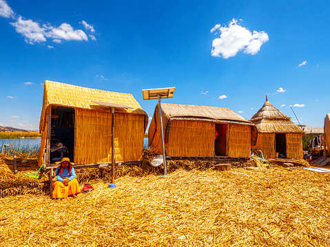 Uros, Peru - October 04, 2021. The floating islands of the Uros on the Lake Titicaca, are made entirely from totora reeds, located at 3 815 meters above sea level, Puno, Peru, South America
