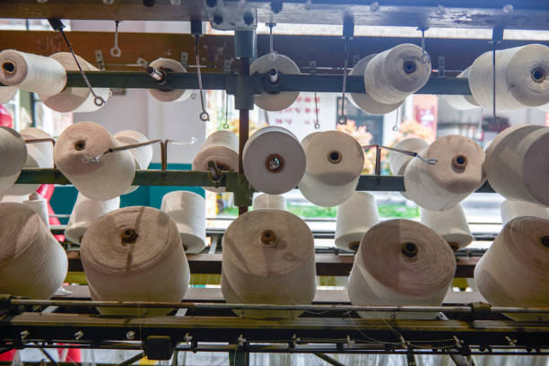 istock A row of bobbins on a cotton spinning machine 1487507670