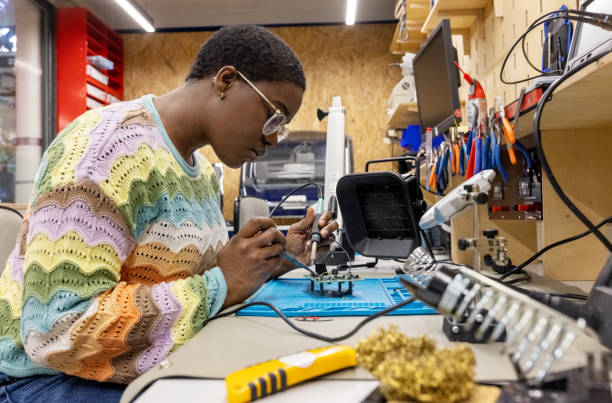 istock African woman repairing circuit board at makers space 1487508021