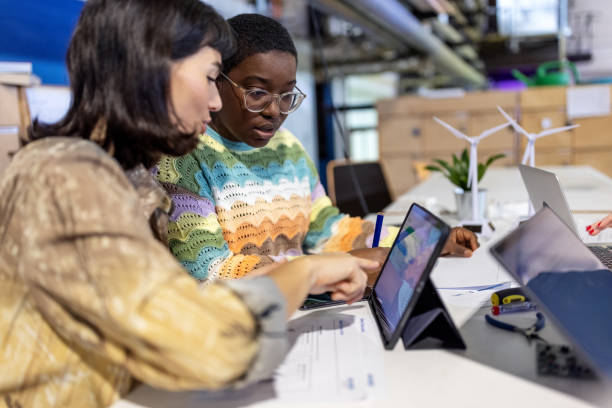 istock Women colleagues looking at laptop and discussing work at startup office 1487508049