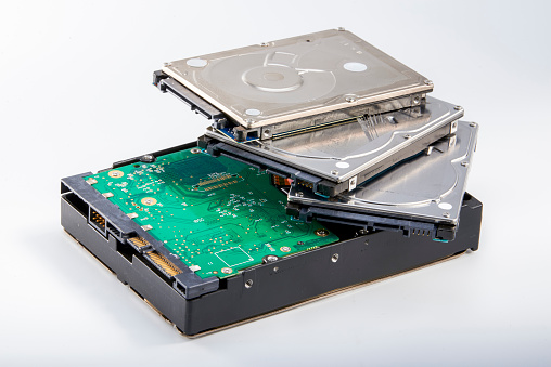 Close-up of three 2.5-inch mechanical hard drives and one 3.5-inch mechanical hard drive