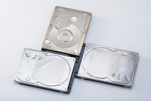 Three 2.5-inch mechanical hard drives close-up