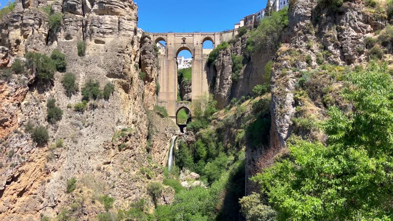 Puente Nuevo bridge what means New Bridge - unique architecture construction over the El Tajo Canyon with Guadalevin river waterfall in Ronda town, province of Malaga, Andalusia, Spain.