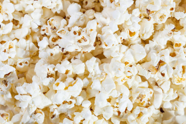 istock popcorn texture background. group of salted popcorns 1487512361