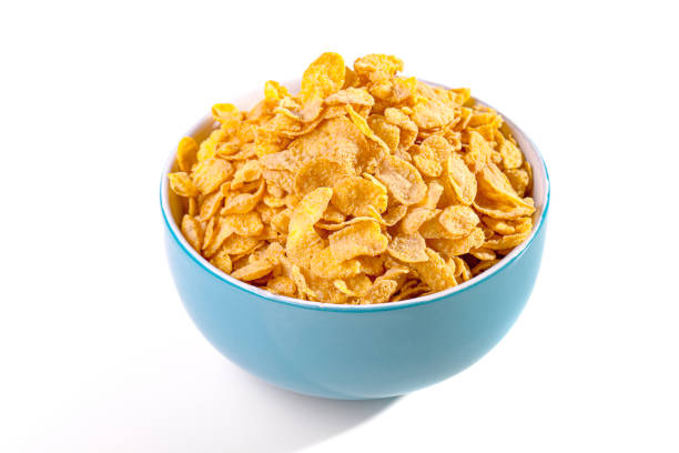 istock blue bowl with corn flakes against white background 1487512392
