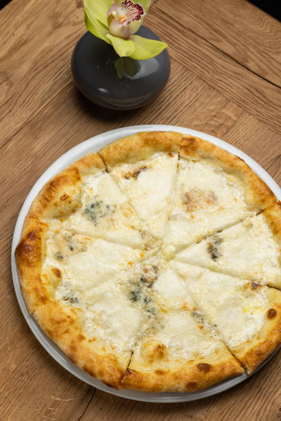 istock delicious italian pizza on a wooden table 1487512571