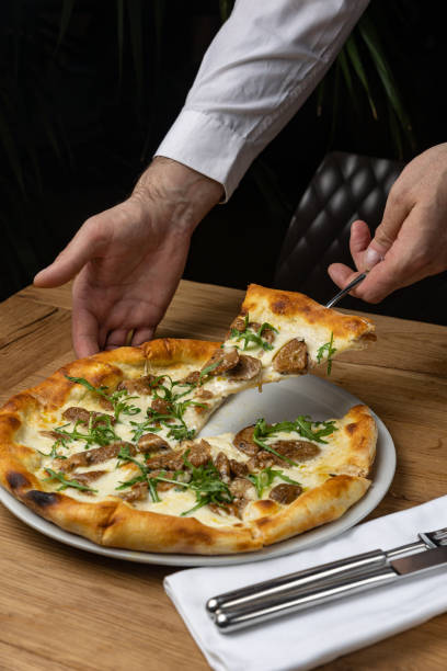 istock delicious italian pizza on a wooden table 1487512583