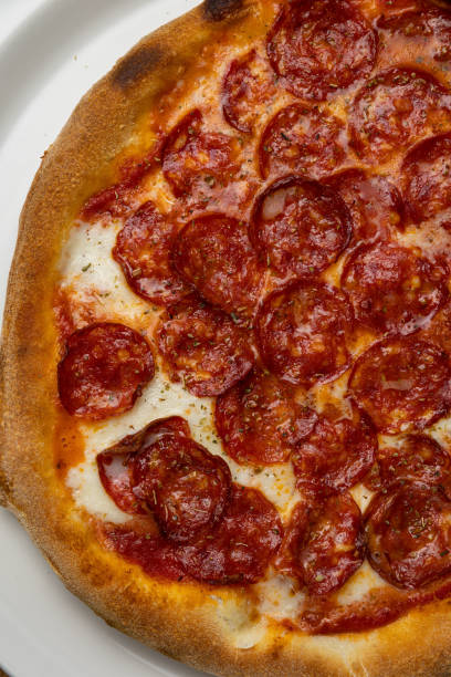 istock delicious italian pizza on a wooden table 1487512788