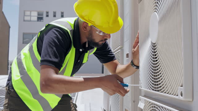 Air conditioning, roof and technician man repair, maintenance and working on fan or aircon power generator. Electrician person, handyman or contractor tools, screwdriver and industry labor services