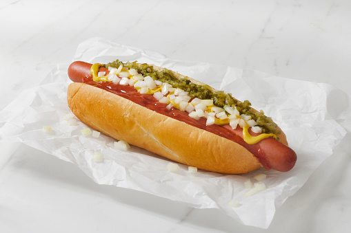 The Foot Long Ballpark Hot Dog with, Ketchup, Mustard, Relish and Onions