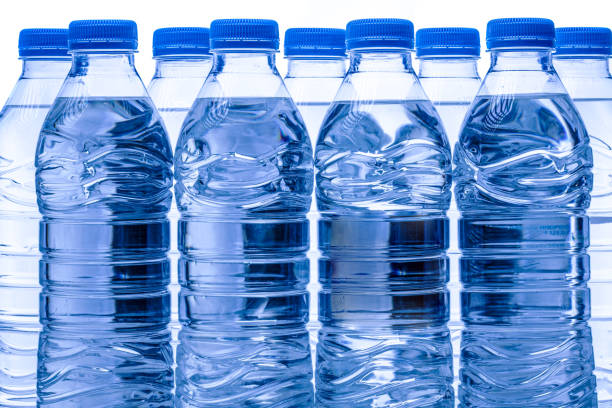 istock pile of half litre plastic water bottles with blue cap 1487517287