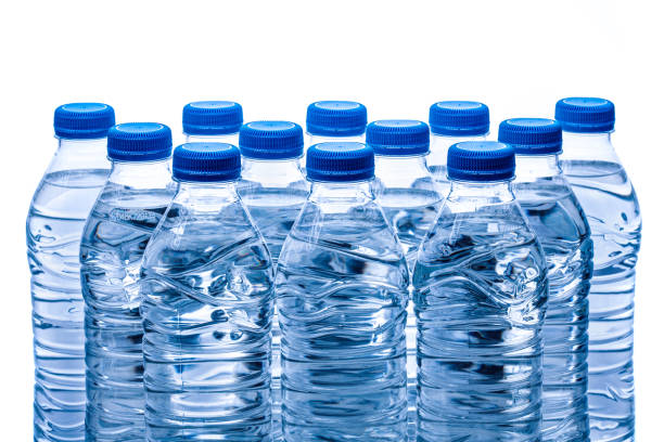 istock pile of half litre plastic water bottles with blue cap 1487517295