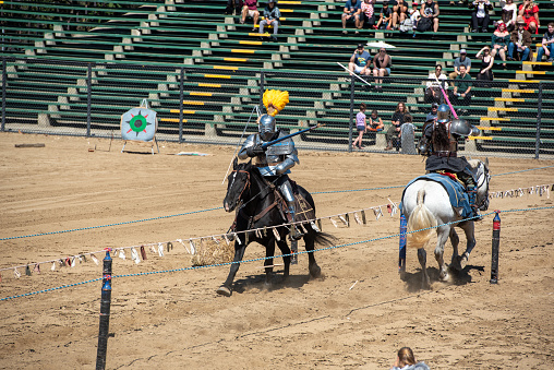 Folsom, CA.  Jousting at the Folsom Renaissance Faire in the arena with the public watching