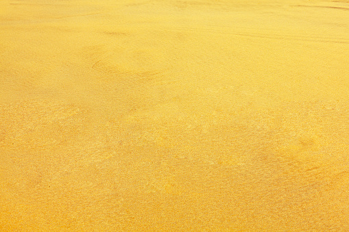 Golden sand background . Texture of sandy desert