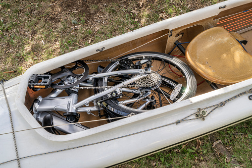 folding bike packed into a cockpit of expedition canoe