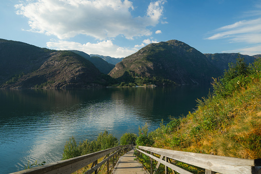 Stairs lead to fjord in Norway  on sunny day in summer
