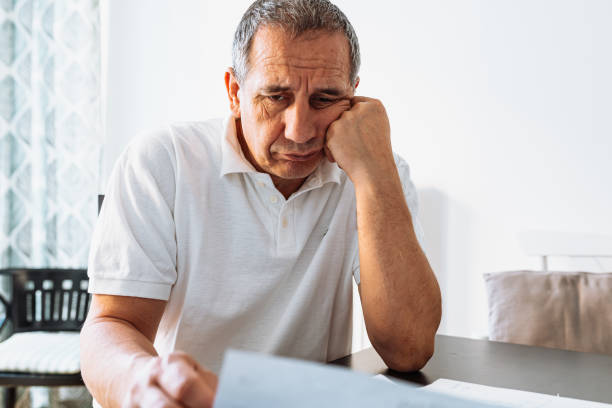 istock Retraining getting an education in middle age, writing an article, checking financial report 1487521560