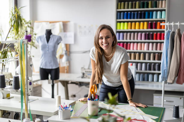istock Young fashion designer at her workplace 1487522024