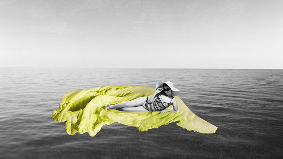 Contemporary art collage with one charming girl, woman using lettuce swimming mattress and resting on sea over monochrome background. Healthy lifestyle, food, nutrition, dietary, vitamins concept