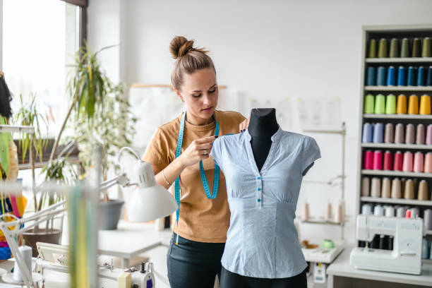 istock Young fashion designer working at her workplace 1487522214