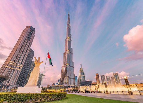 18 January 2023, Dubai, UAE: People and tourists walking by promenade near Burj Khalifa highest skyscraper in Arab Emirates