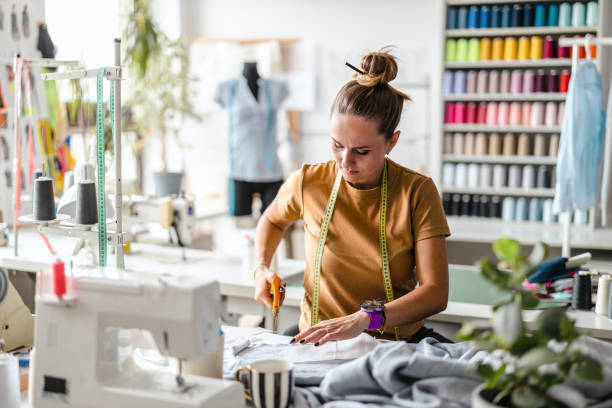 istock Young fashion designer working at her workplace 1487522519