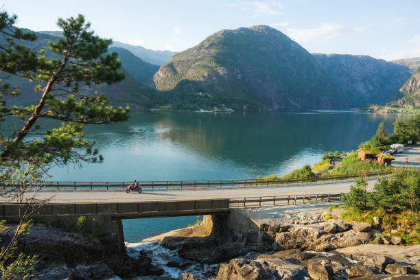Scenic view of motorcycle  on bridge across the river in Norway