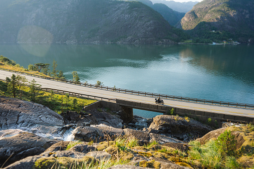 Scenic view of motorcycle  on bridge across the river in Norway