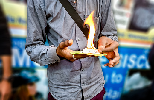 A fire paan, a special variety of flaming betel leaf being prepared in the hands of seller