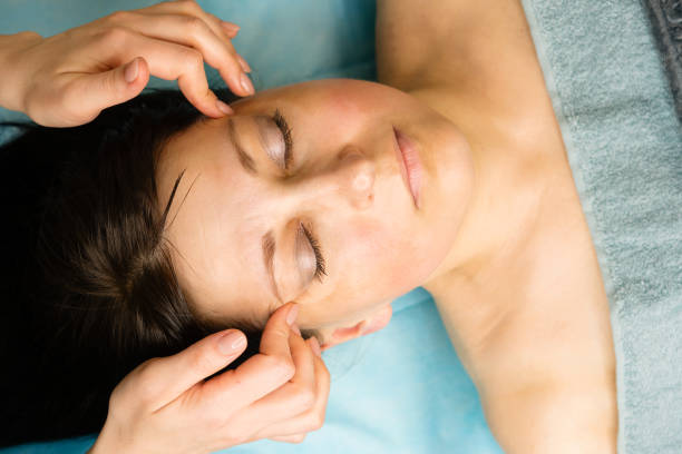 istock Facial massage procedure at cosmetologist 1487524373