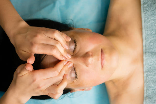 istock Facial massage procedure at cosmetologist 1487524376
