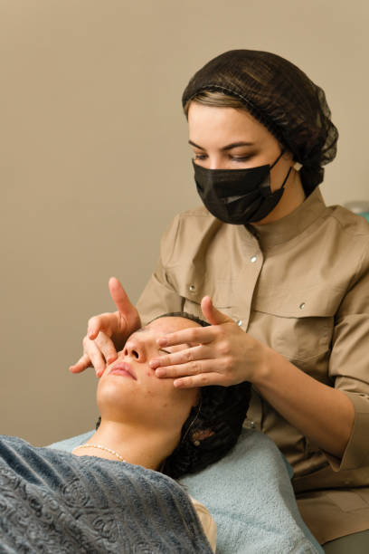 istock Cosmetology face massage procedure 1487525038