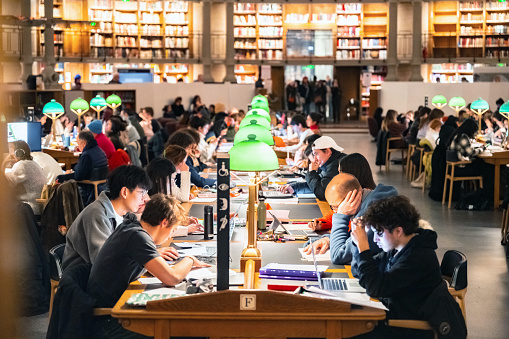 Paris, France - December 11, 2022: people sitting in the large reading hall of the public Richelieu  National library