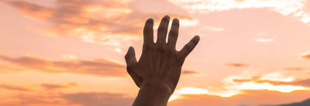 istock open human hand in the sunset 1487525160