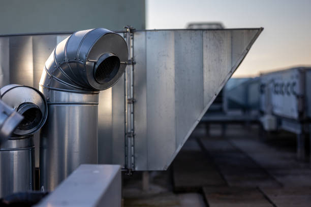 istock External unit of commercial air conditioning and ventilation system installed on industrial building roof. 1487525305