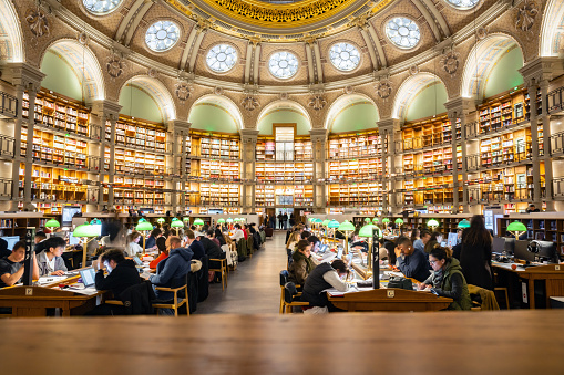 Paris, France - December 11, 2022: people sitting in the large reading hall of the public Richelieu  National library