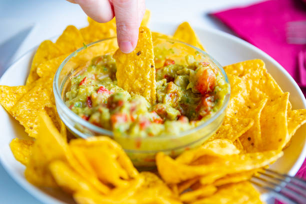 NAchos with guacamole bowl, summer in the beach stock photo