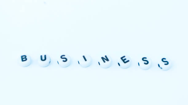 istock BUSINESS word made with word beads isolated on white. Text design 1487531378