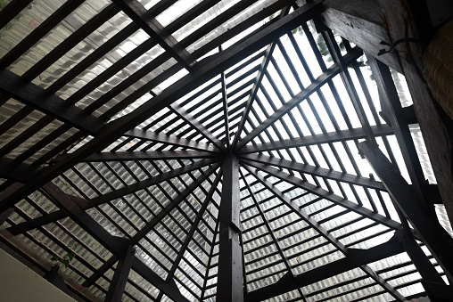 Roof structure of a modern building Made of wood and covered with transparent tile bringing natural light into the buildin