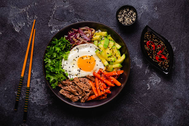 istock Traditional Korean dish Bibimbap: rice with vegetables beef and egg. 1487535579