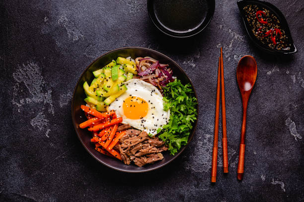 istock Traditional Korean dish Bibimbap: rice with vegetables beef and egg. 1487535681