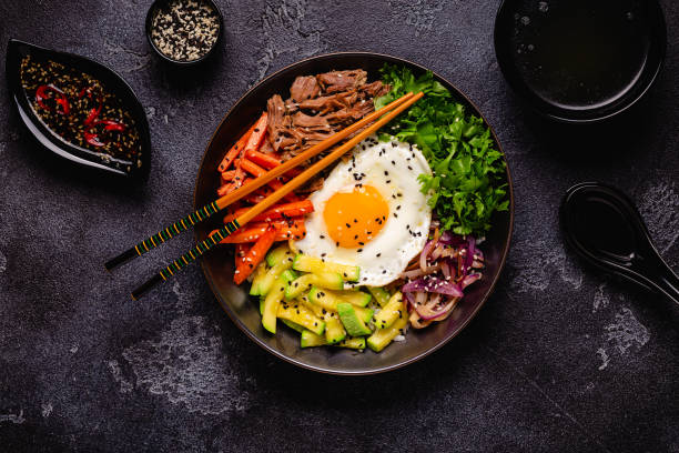 istock Traditional Korean dish Bibimbap: rice with vegetables beef and egg. 1487535781