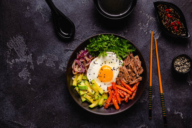istock Traditional Korean dish Bibimbap: rice with vegetables beef and egg. 1487535813