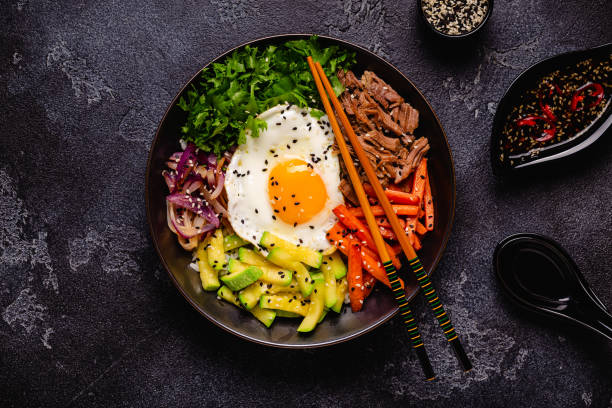 istock Traditional Korean dish Bibimbap: rice with vegetables beef and egg. 1487535941