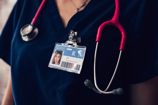 Portrait of a nurse with the badge and stethoscope.