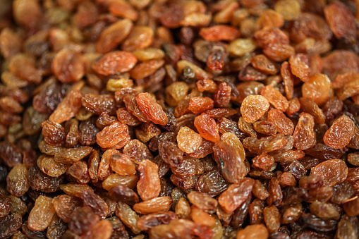 High angle view of black raisins Image made in studio with a macro lens.