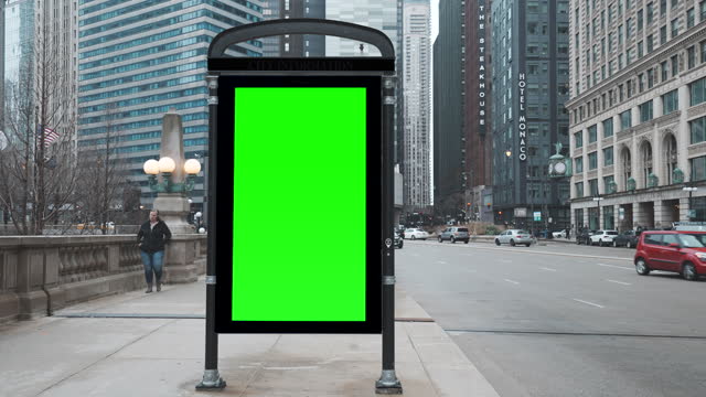 Green wrinkled poster template in city. Glued paper mockup. Blank wheatpaste on textured wall. Empty street art sticker mock up. Billboard advertisment advertiser in Chicago, Illinois, USA