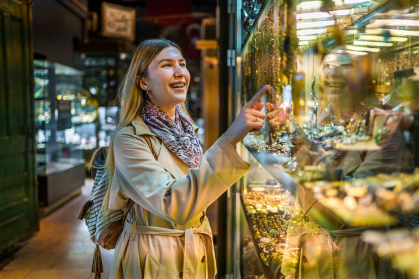 istock Woman looking at a jewelry store window 1487543524