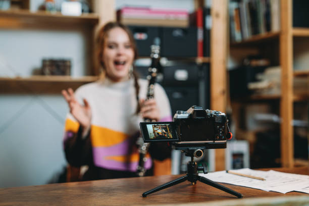 istock A musician is recording a video while she's playing clarinet 1487545575