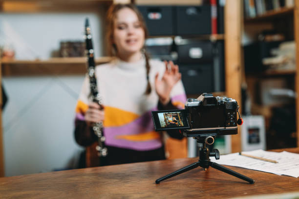 istock A musician is recording a video while she's playing clarinet 1487545591